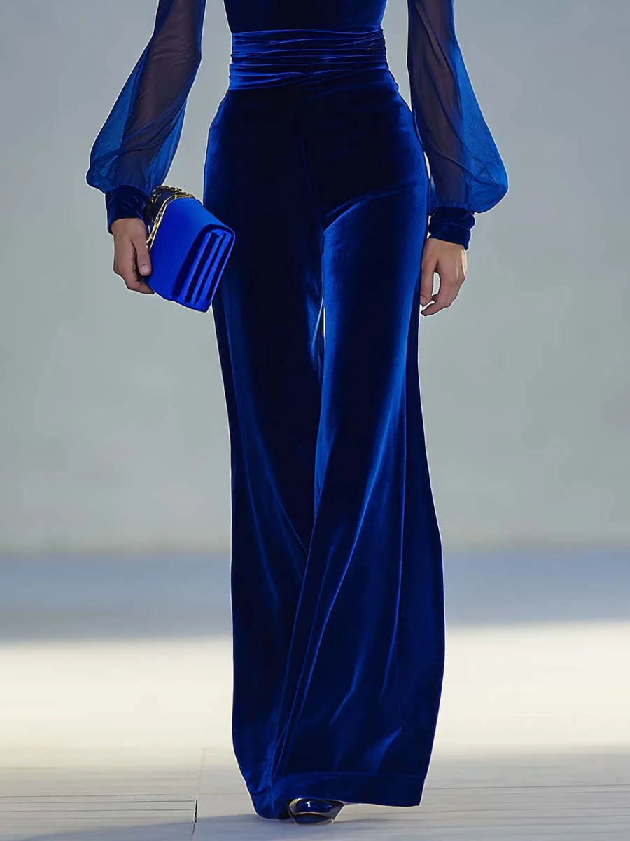 Sabrina – lång jumpsuit i sammet med v-ringning och långa nätärmar, elegant och retro